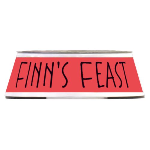 Personalized pet bowl personalized with the saying "Finn's Feast" in black and coral