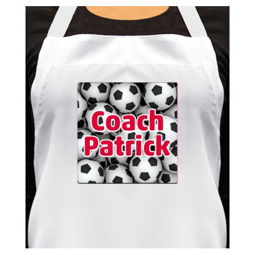 Personalized apron personalized with soccer balls pattern and the saying "Coach Patrick"
