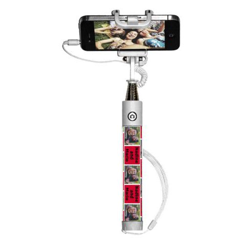 Personalized selfie stick personalized with a photo and the saying "Nadine and Mario" in black and apple red