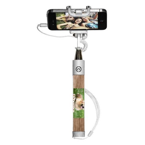 Personalized selfie stick personalized with brown wood pattern and photo and the saying "Duke"