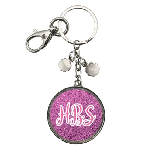 Personalized keychain personalized with light pink glitter pattern and the saying "HBS"