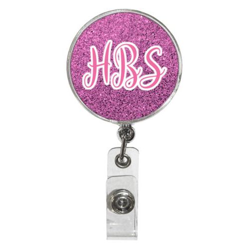 Personalized badge reel personalized with light pink glitter pattern and the saying "HBS"