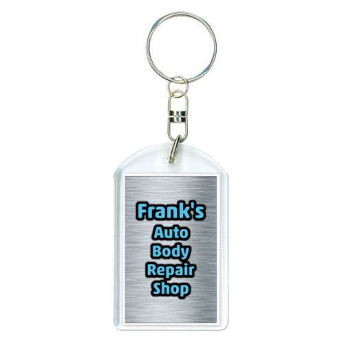 Personalized plastic keychain personalized with steel industrial pattern and the saying "Frank's Auto Body Repair Shop"
