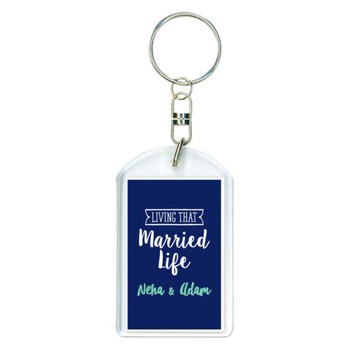 Personalized plastic keychain personalized with the sayings "Neha & Adam" and "living that married life"