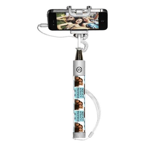 Personalized selfie stick personalized with a photo and the saying "Best Friends" in black and robin's shell