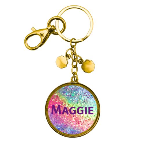 Personalized metal keychain personalized with glitter pattern and the saying "Maggie"