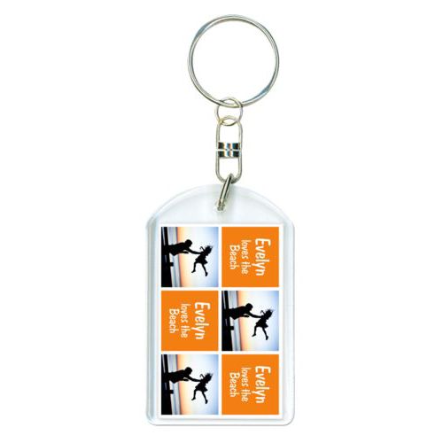 Personalized plastic keychain personalized with a photo and the saying "Evelyn loves the Beach" in juicy orange and white