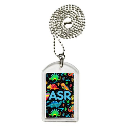Personalized dog tag personalized with dinos pattern and the saying "ASR"