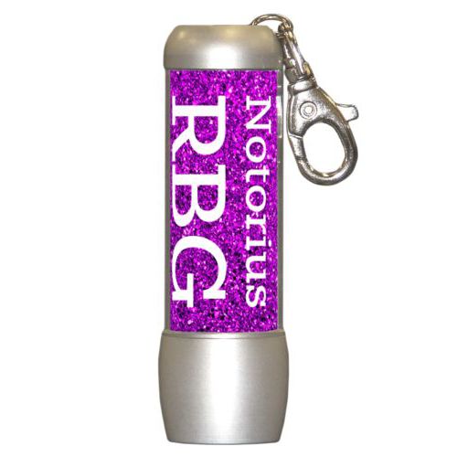 Personalized flashlight personalized with fuchsia glitter pattern and the saying "Notorius RBG"