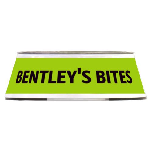 Personalized pet bowl personalized with the saying "BENTLEY'S BITES" in black and juicy green