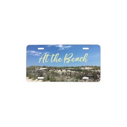 Vanity front license plate personalized with photo and the saying "At the Beach"