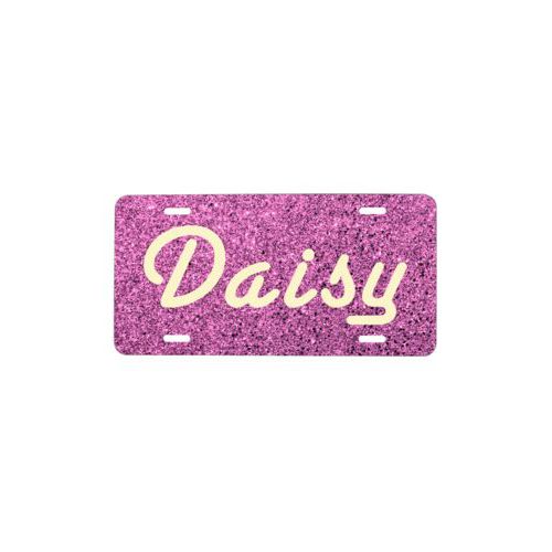 Custom car plate personalized with light pink glitter pattern and the saying "Daisy"