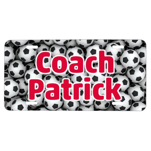Custom license plate personalized with soccer balls pattern and the saying "Coach Patrick"