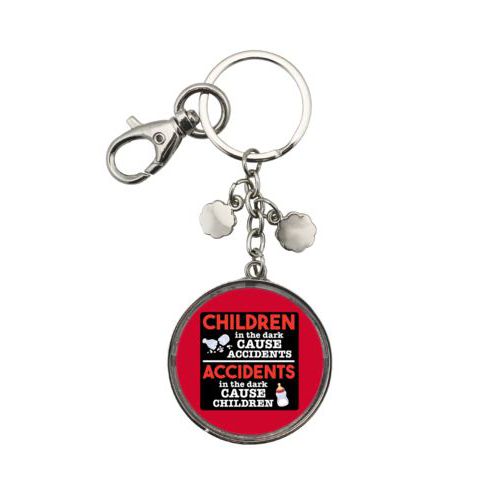Personalized keychain personalized with the saying "Children in the dark cause accidents, accidents in the dark cause children"