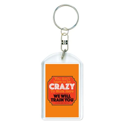 Personalized plastic keychain personalized with the saying "You don't have to be crazy to work here, we will train you"
