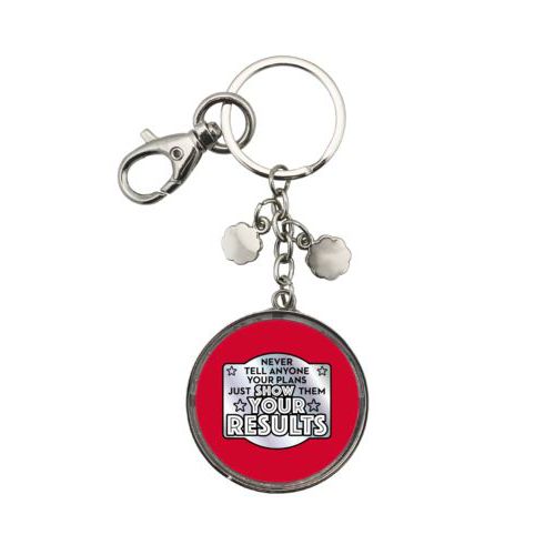Personalized keychain personalized with the saying "Never tell anyone your plans, just show them your results"