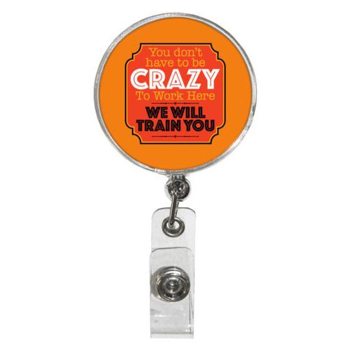 Personalized badge reel personalized with the saying "You don't have to be crazy to work here, we will train you"