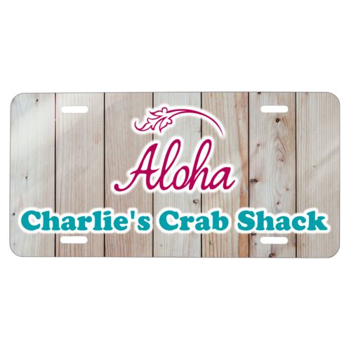 Custom car plate personalized with light wood pattern and the sayings "Aloha" and "Charlie's Crab Shack"