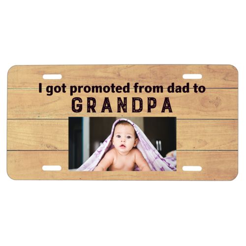 Custom car plate personalized with natural wood pattern and photo and the saying "I got promoted from dad to grandpa"