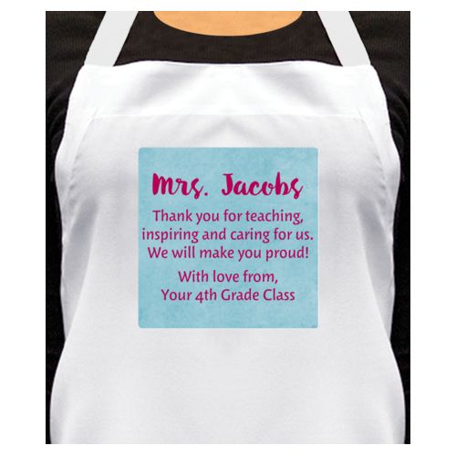 Personalized apron personalized with teal chalk pattern and the saying "Mrs. Jacobs Thank you for teaching, inspiring and caring for us. We will make you proud! With love from, Your 4th Grade Class"