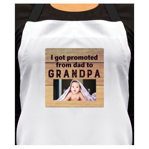 Personalized apron personalized with natural wood pattern and photo and the saying "I got promoted from dad to grandpa"