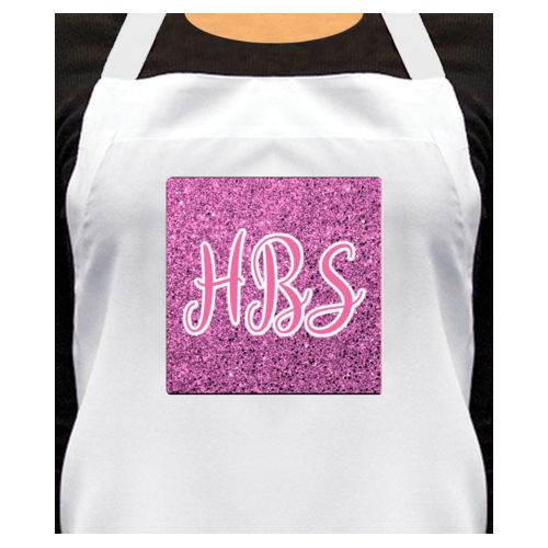Personalized apron personalized with light pink glitter pattern and the saying "HBS"