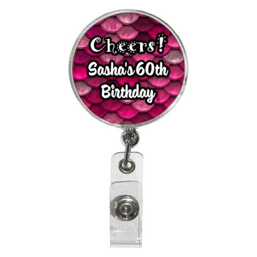 Personalized badge reel personalized with pink mermaid pattern and the saying "Cheers! Sasha's 60th Birthday"