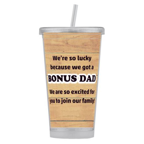 Personalized tumbler personalized with natural wood pattern and the sayings "We're so lucky because we got a We are so excited for you to join our family!" and "BONUS DAD"