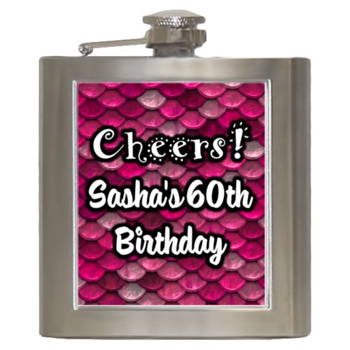 Personalized 6oz flask personalized with pink mermaid pattern and the saying "Cheers! Sasha's 60th Birthday"