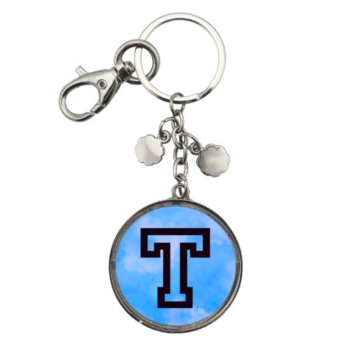 Personalized metal keychain personalized with light blue cloud pattern and the saying "T"