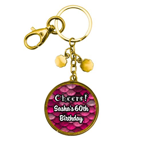 Personalized metal keychain personalized with pink mermaid pattern and the saying "Cheers! Sasha's 60th Birthday"