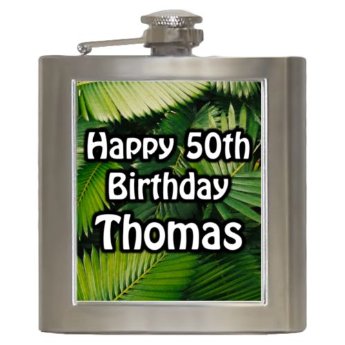 Personalized 6oz flask personalized with plants fern pattern and the saying "Happy 50th Birthday Thomas"