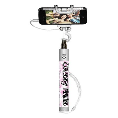 Personalized selfie stick personalized with pink marble pattern and the sayings "Sassy Nails" and "From hand to toe"