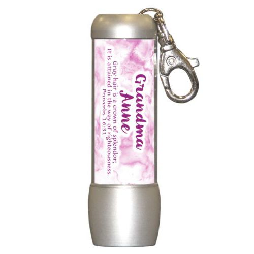 Personalized flashlight personalized with pink marble pattern and the saying "Grandma Anne Gray hair is a crown of splendor; It is attained in the way of righteousness. Proverbs 16:31"