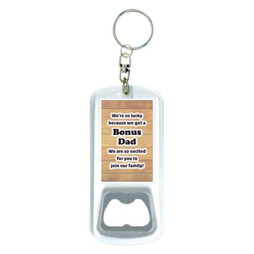 Personalized bottle opener personalized with natural wood pattern and the saying "We're so lucky because we got a Bonus Dad We are so excited for you to join our family!"