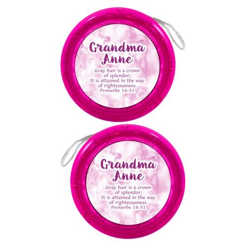 Personalized yoyo personalized with pink marble pattern and the saying "Grandma Anne Gray hair is a crown of splendor; It is attained in the way of righteousness. Proverbs 16:31"