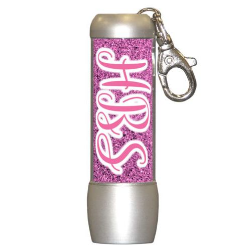 Personalized flashlight personalized with light pink glitter pattern and the saying "HBS"