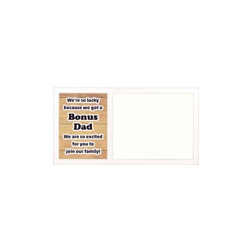 Personalized white board personalized with natural wood pattern and the saying "We're so lucky because we got a Bonus Dad We are so excited for you to join our family!"