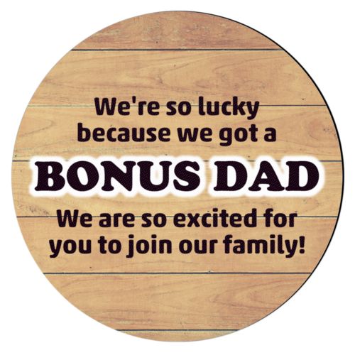 Personalized coaster personalized with natural wood pattern and the sayings "We're so lucky because we got a We are so excited for you to join our family!" and "BONUS DAD"