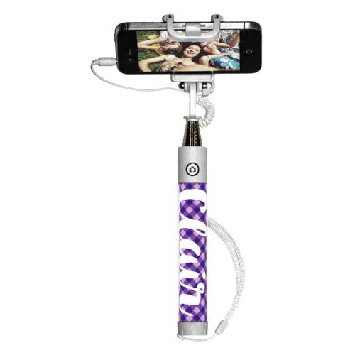 Personalized selfie stick personalized with check pattern and the saying "Clair"