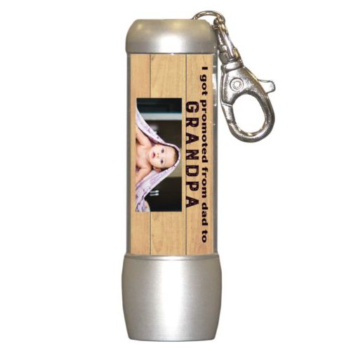 Personalized flashlight personalized with natural wood pattern and photo and the saying "I got promoted from dad to grandpa"