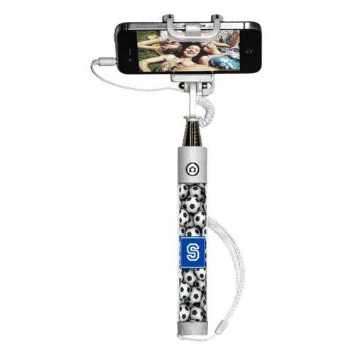 Personalized selfie stick personalized with soccer balls pattern and initial in royal blue