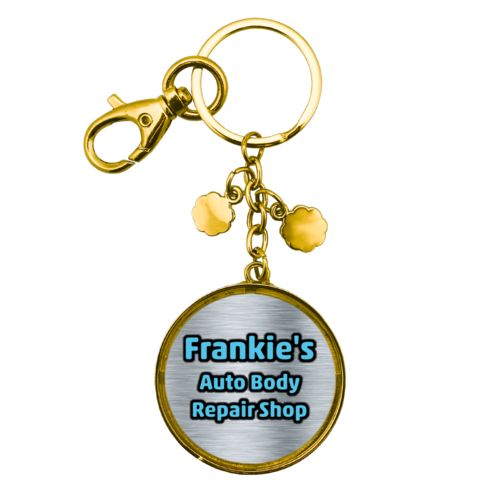 Personalized metal keychain personalized with steel industrial pattern and the saying "Frankie's Auto Body Repair Shop"