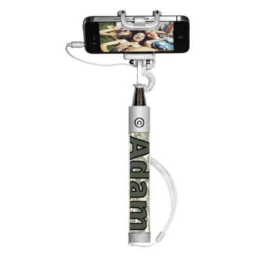 Personalized selfie stick personalized with army camo pattern and the saying "Adam"