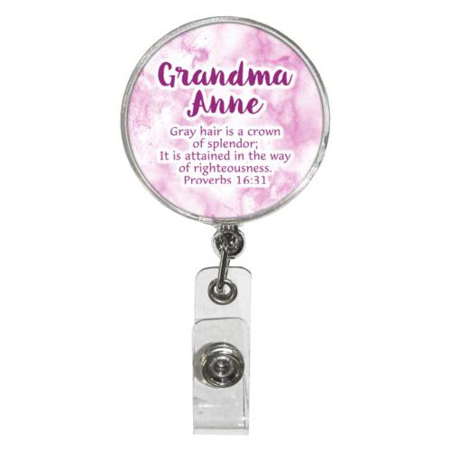 Personalized badge reel personalized with pink marble pattern and the saying "Grandma Anne Gray hair is a crown of splendor; It is attained in the way of righteousness. Proverbs 16:31"