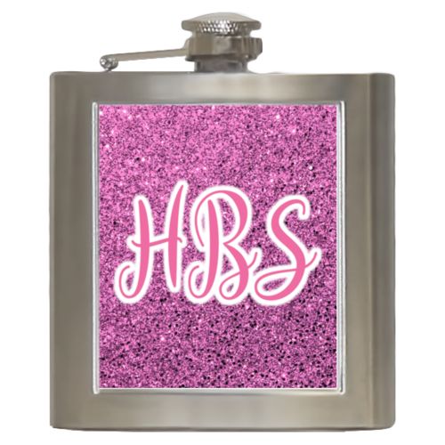 Personalized 6oz flask personalized with light pink glitter pattern and the saying "HBS"