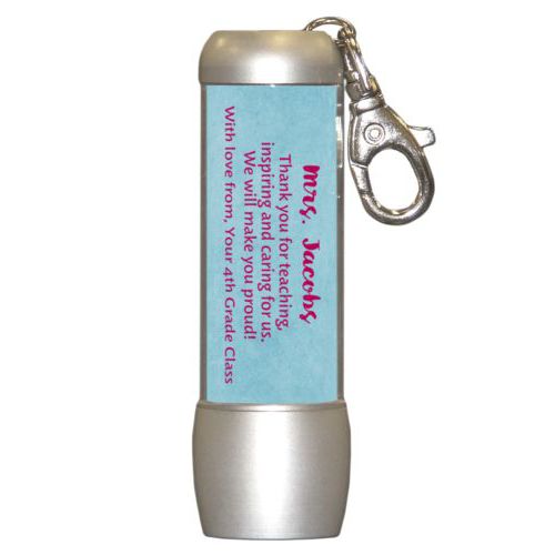 Personalized flashlight personalized with teal chalk pattern and the saying "Mrs. Jacobs Thank you for teaching, inspiring and caring for us. We will make you proud! With love from, Your 4th Grade Class"