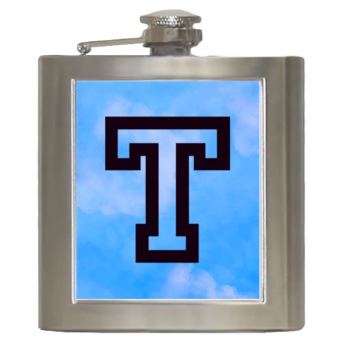 Personalized 6oz flask personalized with light blue cloud pattern and the saying "T"