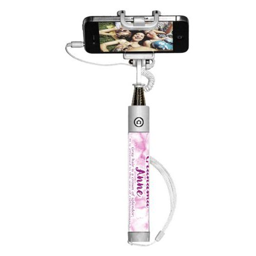 Personalized selfie stick personalized with pink marble pattern and the saying "Grandma Anne Gray hair is a crown of splendor; It is attained in the way of righteousness. Proverbs 16:31"