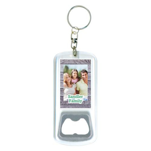 Personalized bottle opener personalized with grey wood pattern and photo and the saying "Sandler Family"